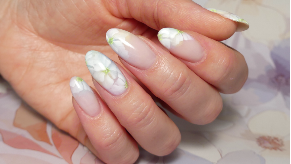 Almond nails with hand painted white flowers nail art
